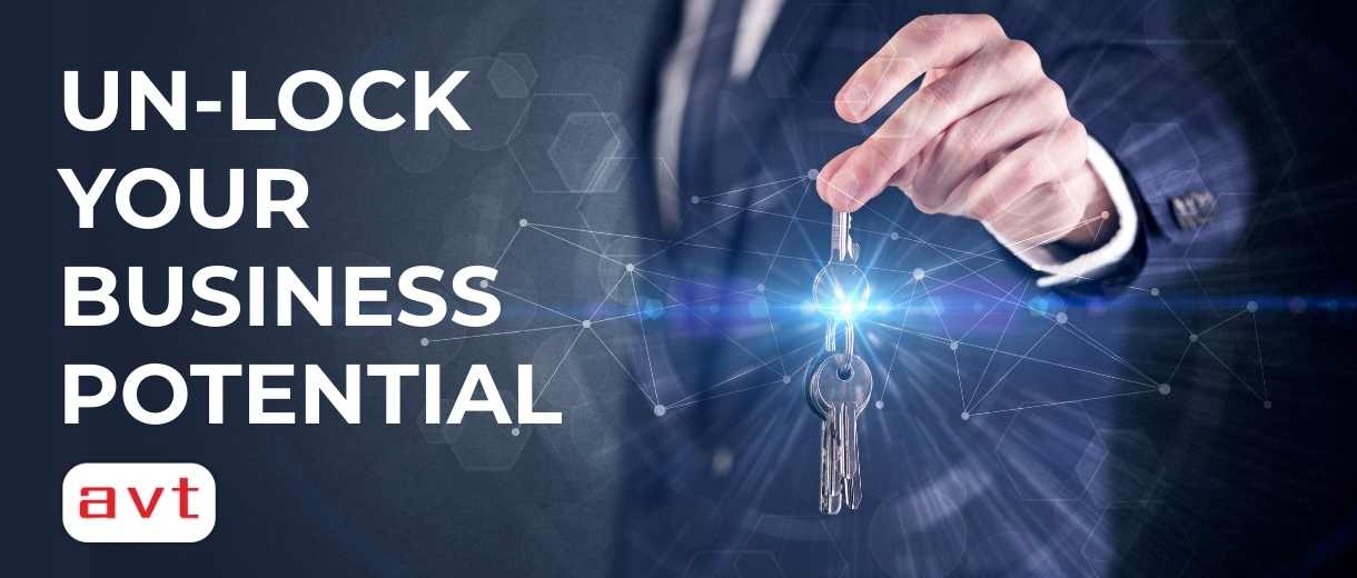 Businessman in suit holding over a key